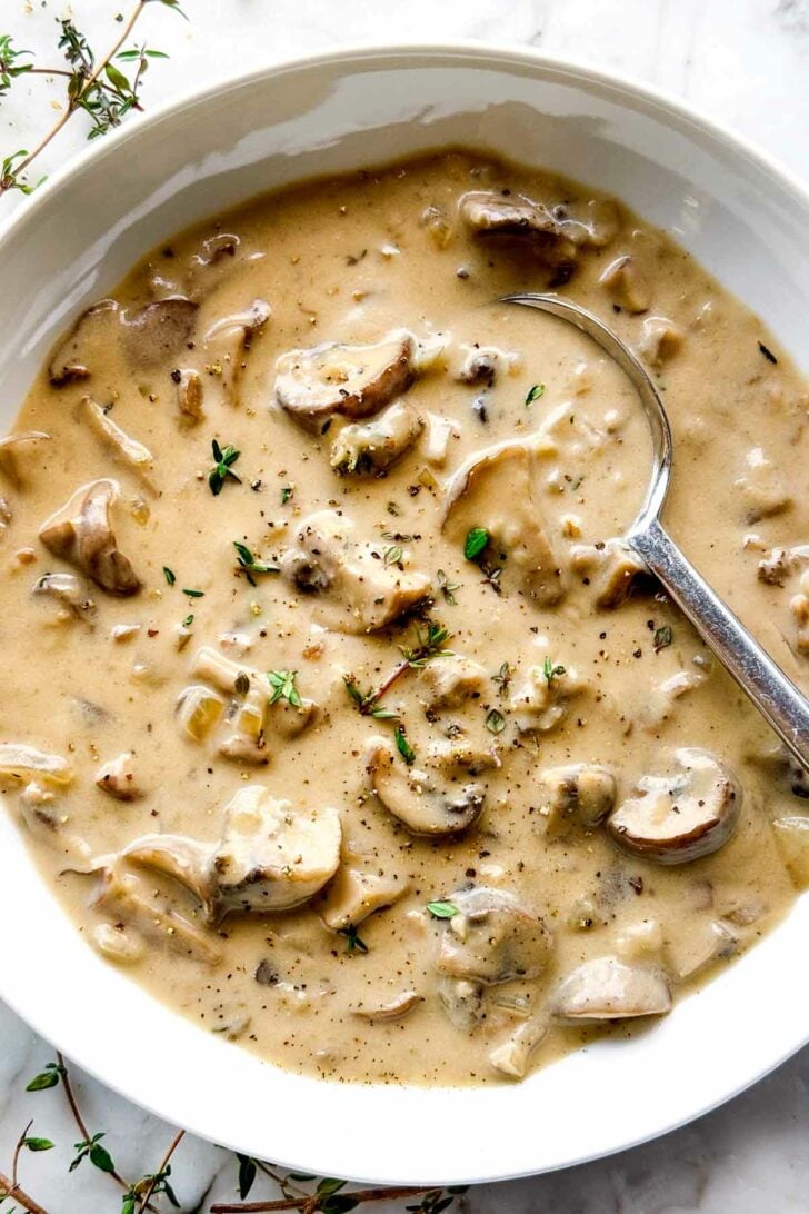 Cream of Mushroom Soup in bowl with spoon foodiecrush.com