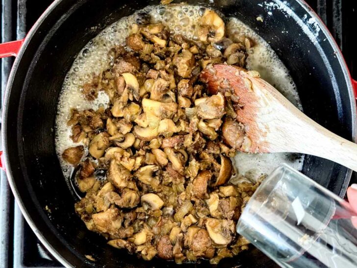 Saute mushrooms in pot with wine deglaze pan Cream of Mushroom Soup foodiecrush.com
