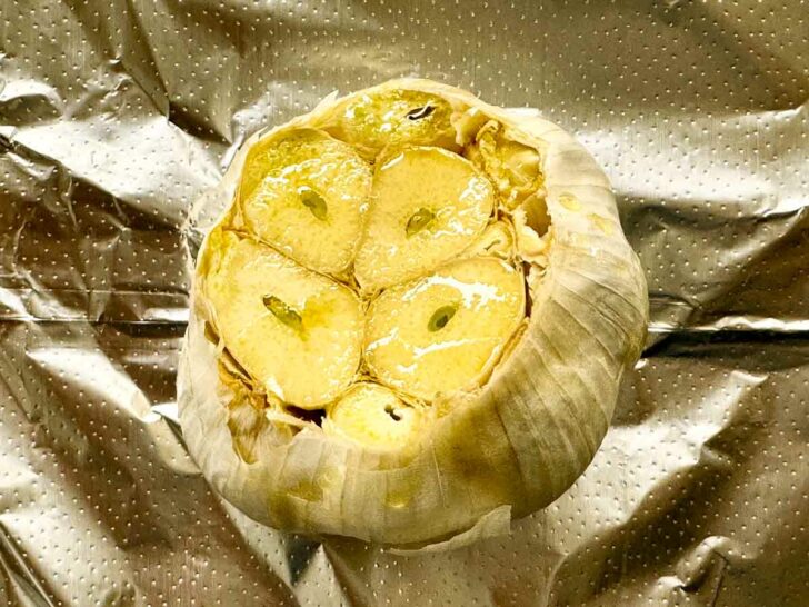 Garlic bulb in foil how to make roasted garlic foodiecrush.com #roastedgarlic