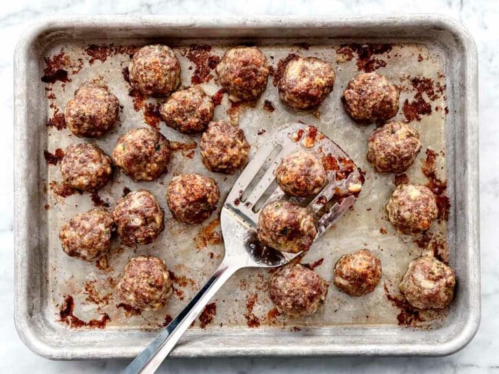 Cooked meatballs on baking sheet foodiecrush.com