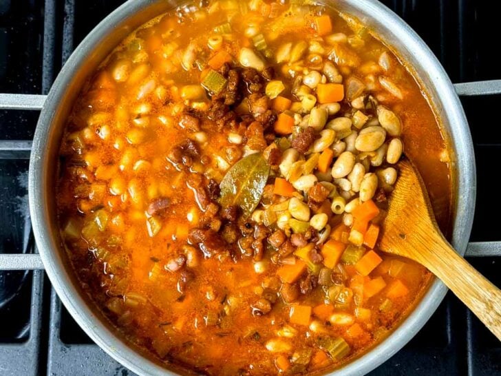 Pasta Fagioli Soup in pot with spoon on stove foodiecrush.com
