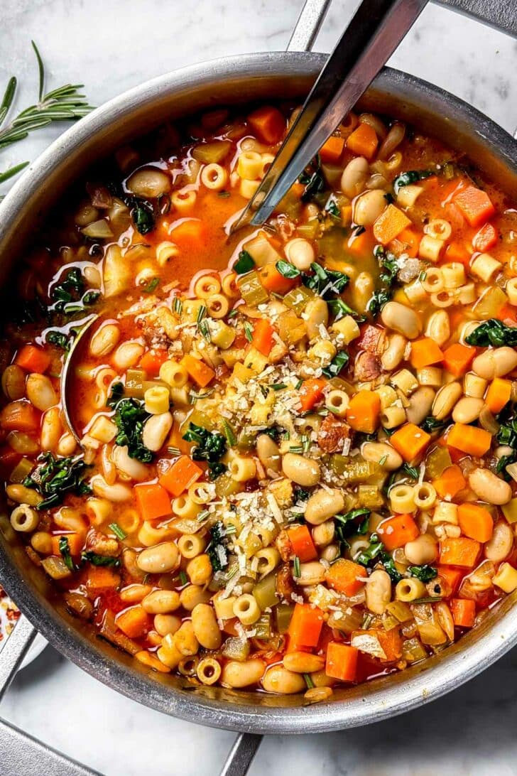 Pasta Fagioli Soup with kale in pot with ladle recipe foodiecrush.com