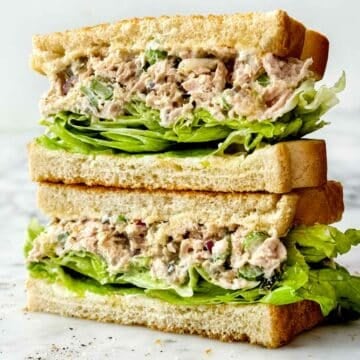 Tuna Salad Sandwich recipe stacked on toasted bread and lettuce foodiecrush.com