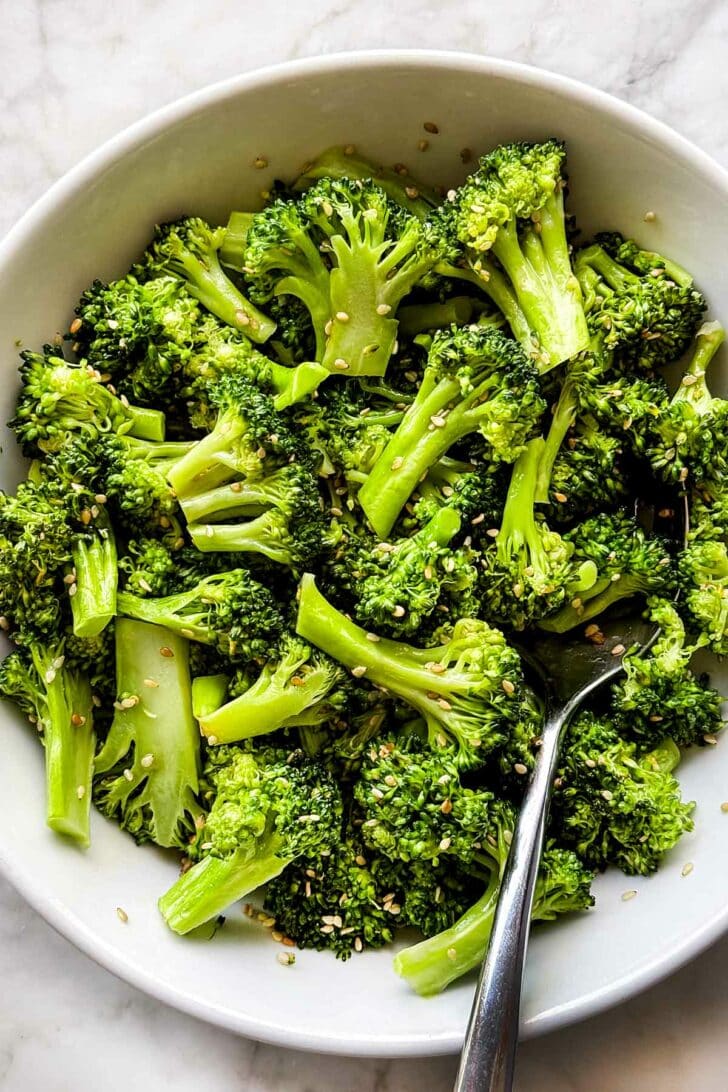 Sesame Broccoli recipe in bowl with spoon foodiecrush.com