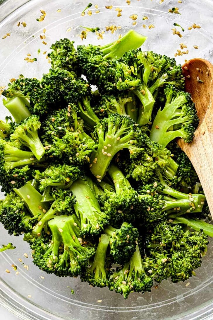 Sesame Broccoli recipe in bowl with wooden spoon foodiecrush.com