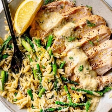 Creamy Greek Chicken with Orzo on plate with fork foodiecrush.com