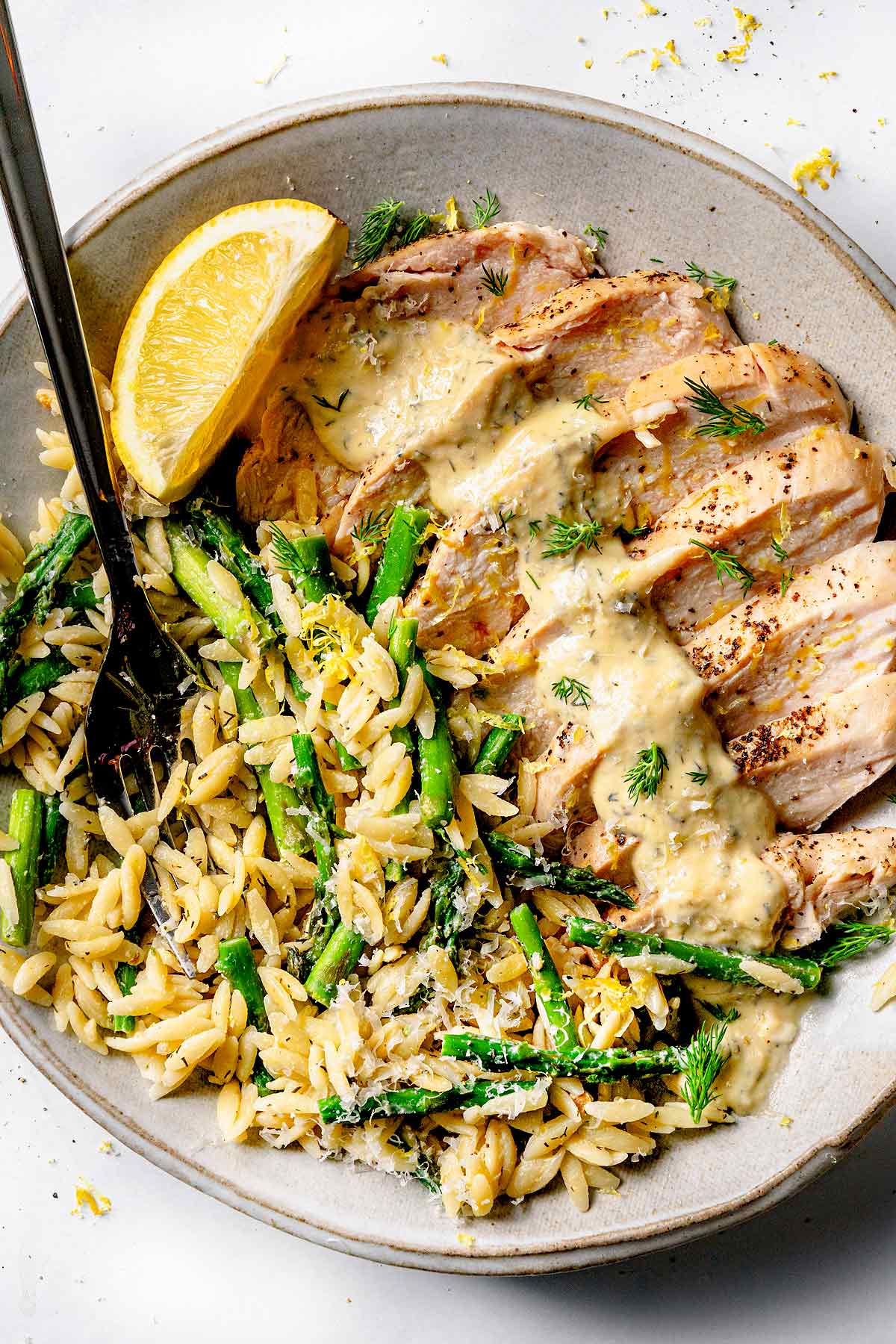 Creamy Greek Chicken with Orzo on plate with fork foodiecrush.com