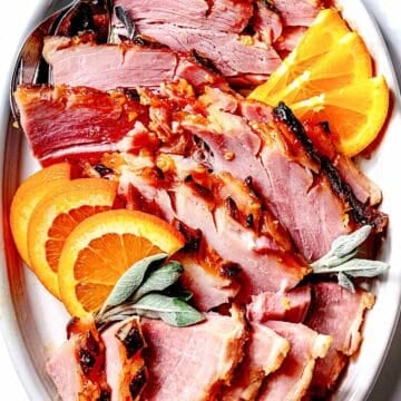 Sliced ham with ham glaze on serving platter foodiecrush.com