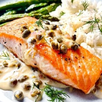 Creamy Salmon Picatta on plate with rice and asparagus