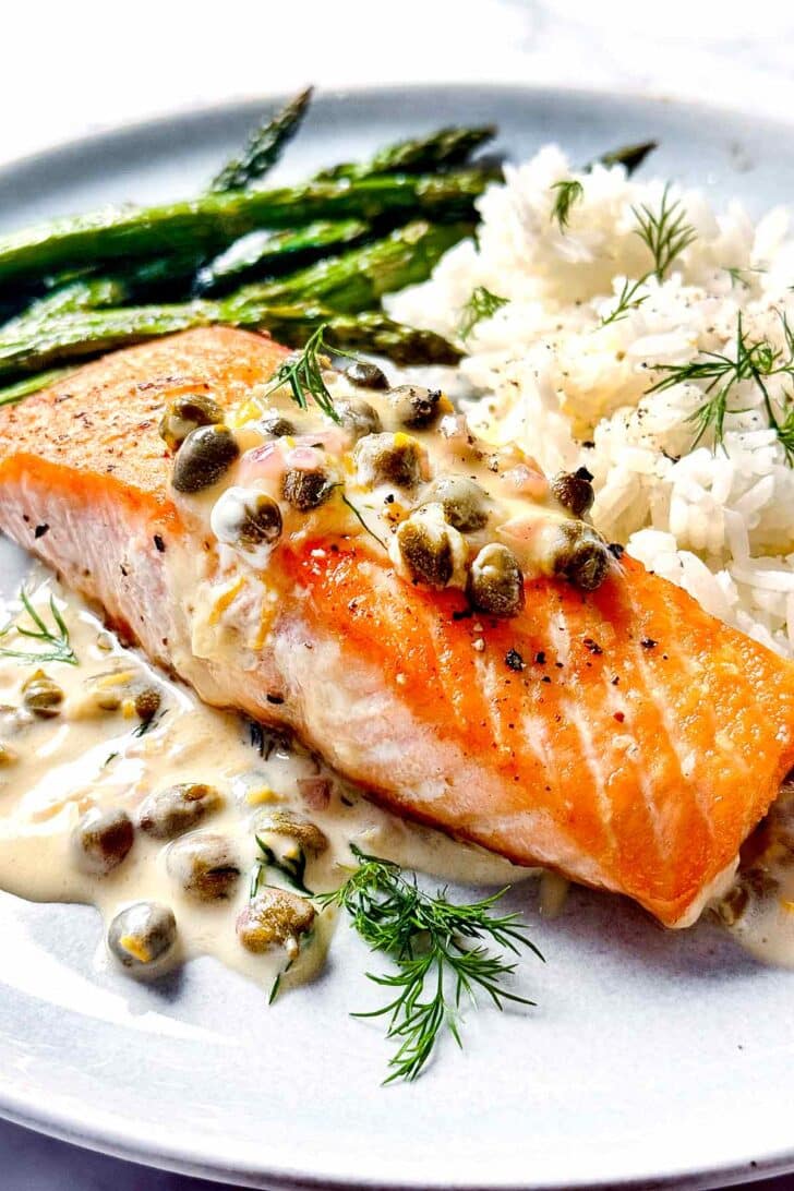 Creamy Salmon Picatta on plate with rice and asparagus