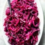 Sweet and Sour Red Cabbage in serving dish with spoon