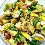 Pesto Potato Salad with egg and green beans in bowl