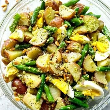 Pesto Potato Salad with egg and green beans in bowl