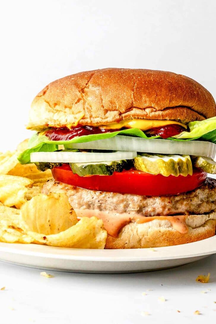 Turkey burger on bun with potato chips
