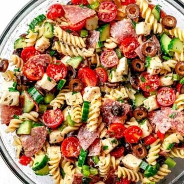 Italian Pasta Salad with tomatoes, salami, cucumber, mozzarella, and black olives