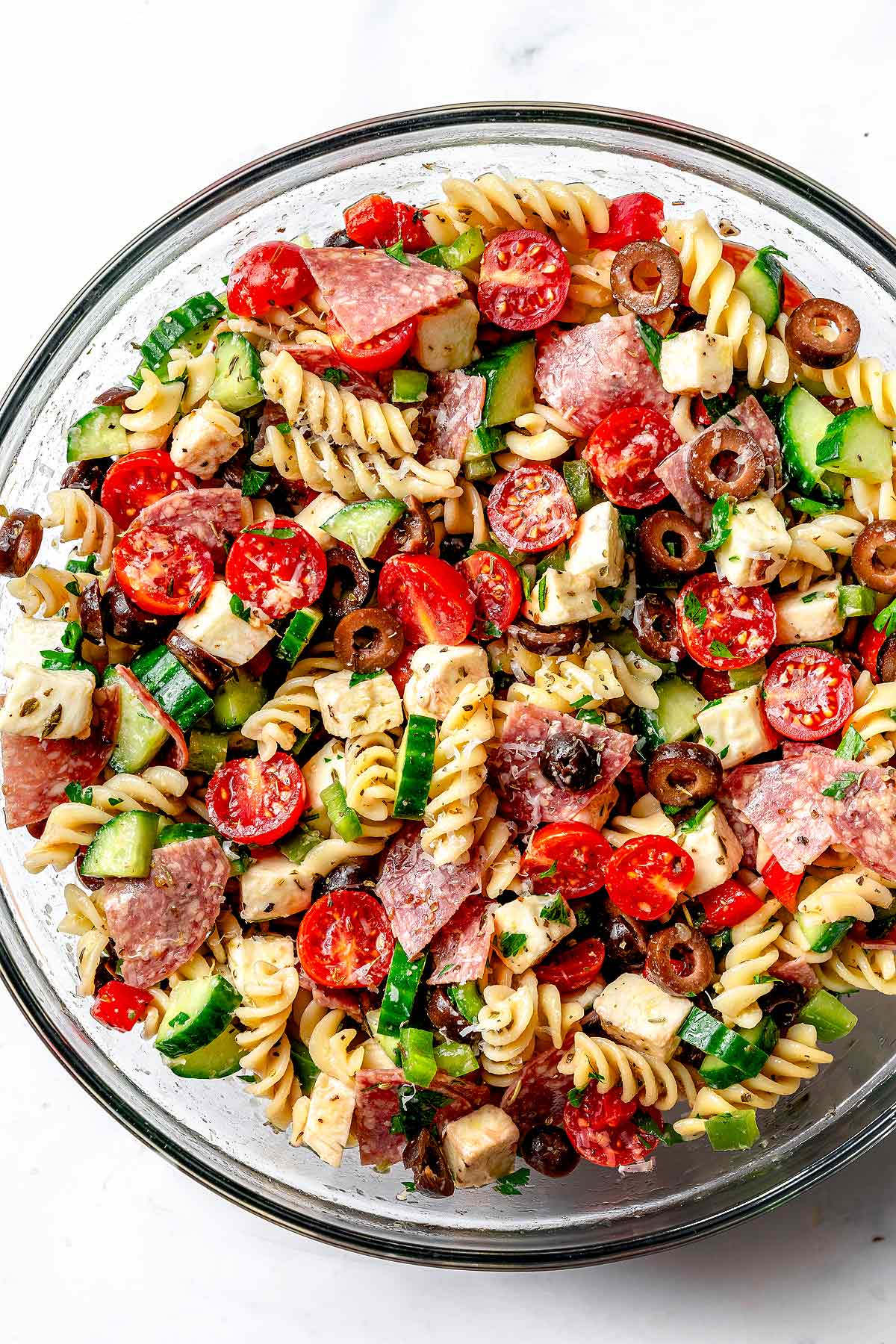 Italian Pasta Salad with tomatoes, salami, cucumber, mozzarella, and black olives