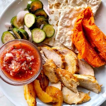 Grilled Chicken with Peaches with salads on plate
