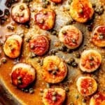Seared Scallops in brown butter sauce in skillet