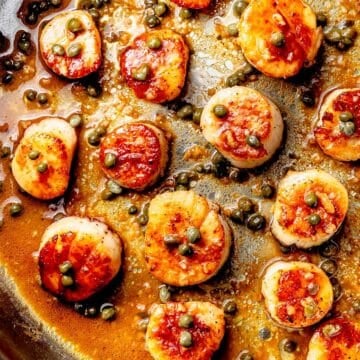 Seared Scallops in brown butter sauce in skillet