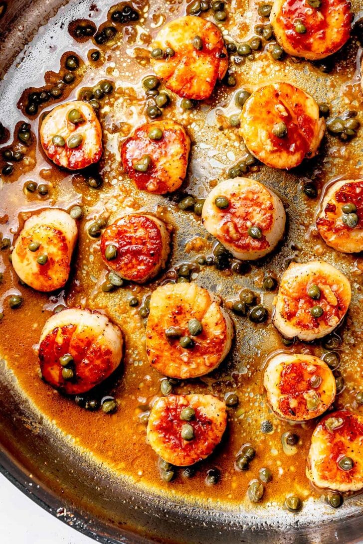 Seared Scallops in brown butter sauce in skillet