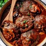 Salisbury Steak with mushroom sauce in skillet foodiecrush.com