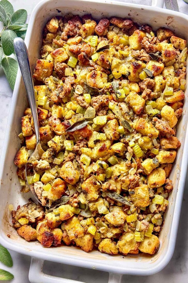 Sausage Stuffing recipe in baking dish with spoon
