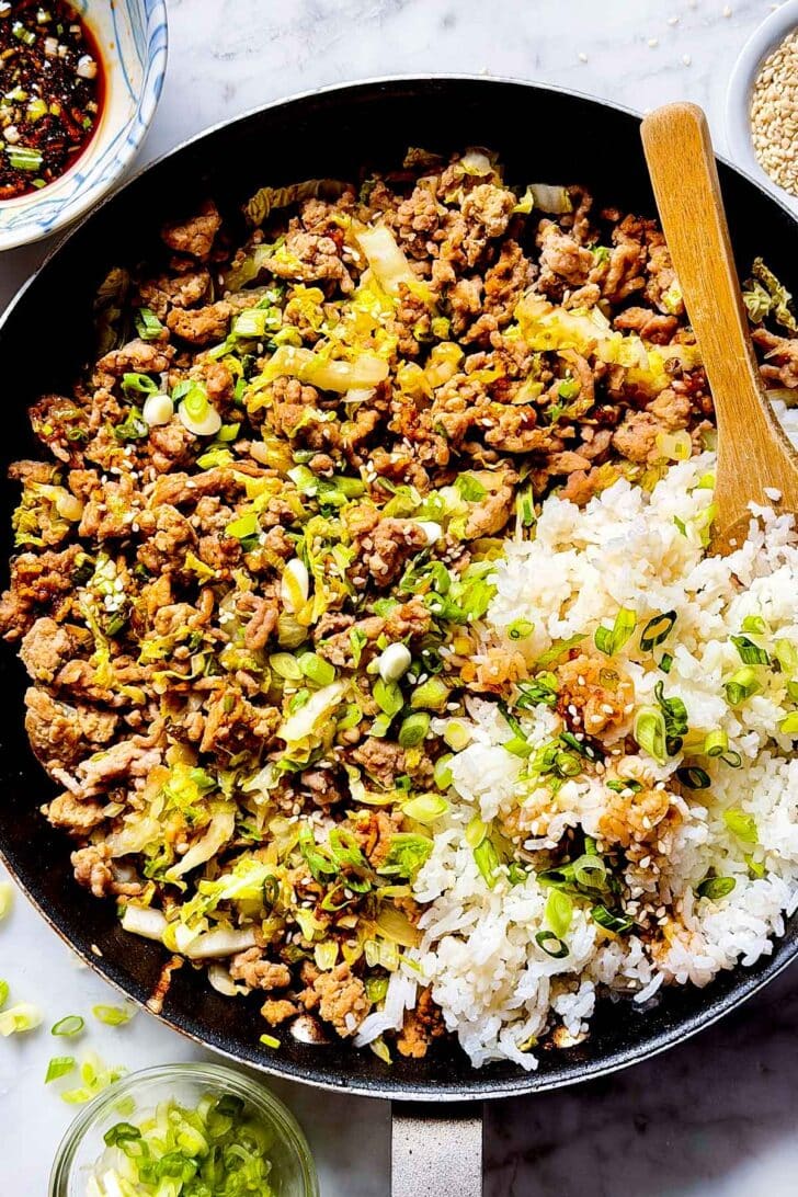 Potsticker Rice Bowls in skillet with spoon