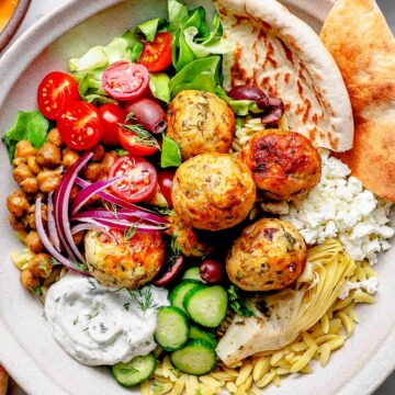Mediterranean Chicken Meatball Bowls with pita bread and orzo