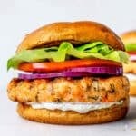 Salmon Burger on bun with cucumber dill sauce