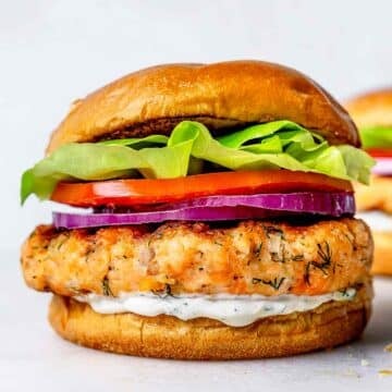 Salmon Burger on bun with cucumber dill sauce