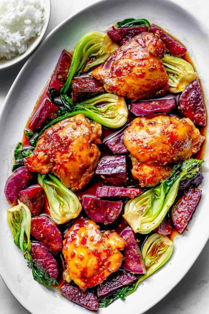 Sweet Soy Glazed Chicken Thighs with Japanese Sweet Potatoes and Bok Choy on serving platter