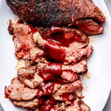 Grilled Tri Tip Santa Maria Tri Tip Recipe with bbq sauce on platter