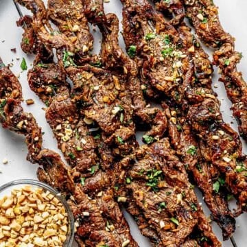 Coconut Beef Skewers on platter