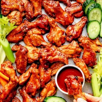 Sticky Chicken Wings recipe on platter with dipping sauce