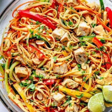 Thai Noodle Salad with Chicken in bowl with serving spoon