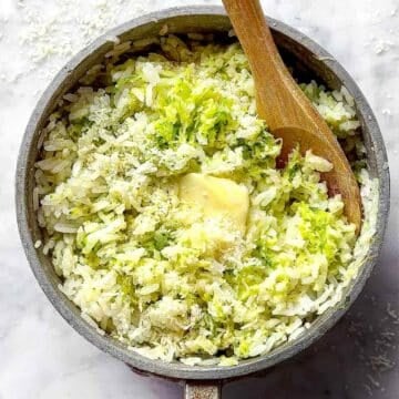 Zucchini Rice with butter recipe in pot with spoon