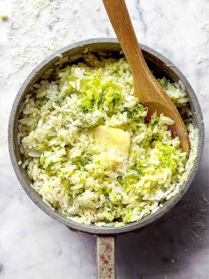 Zucchini Rice with butter recipe in pot with spoon