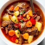 Hungarian Goulash in bowl with spoon