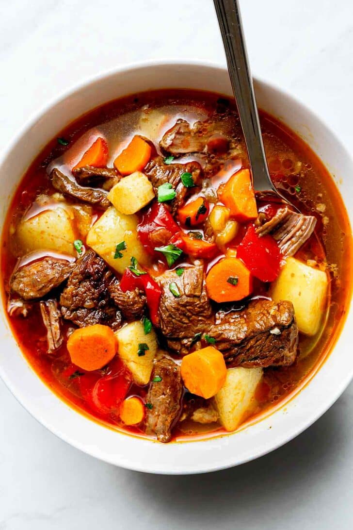 Hungarian Goulash in bowl with spoon 